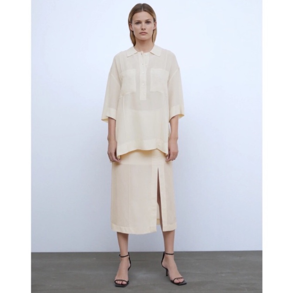 Zara’s vented semi-sheer blouse